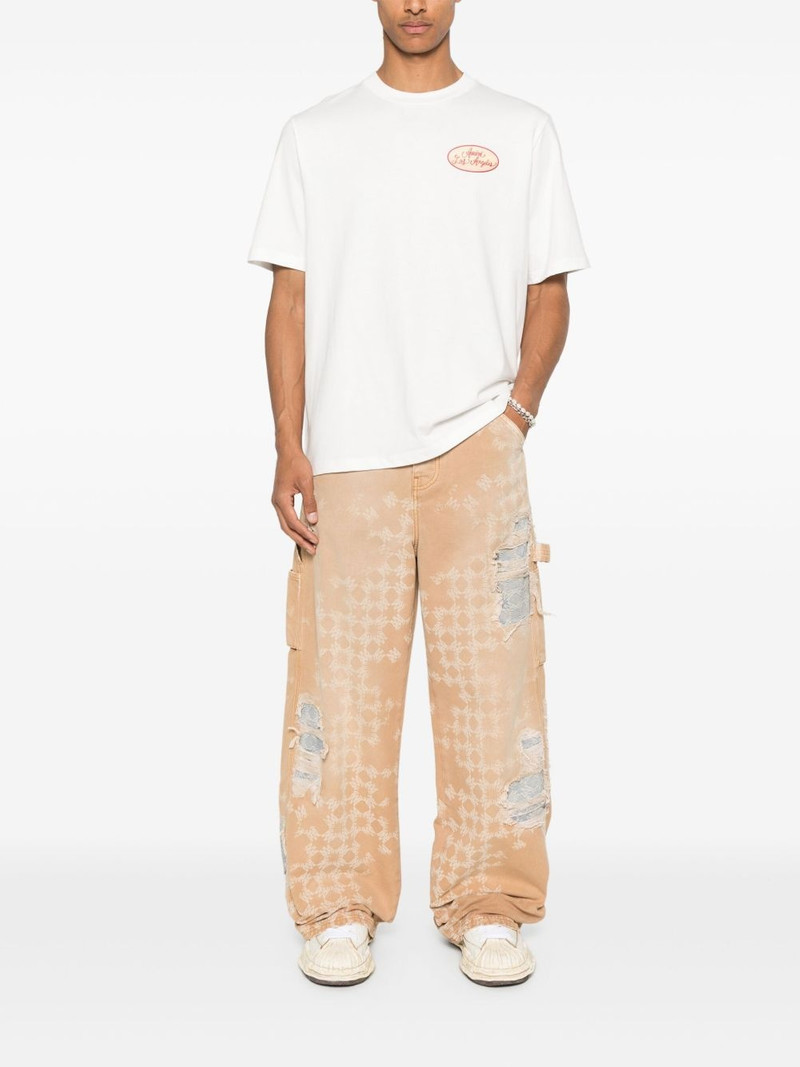 AMIRI distressed straight-leg jeans outlook