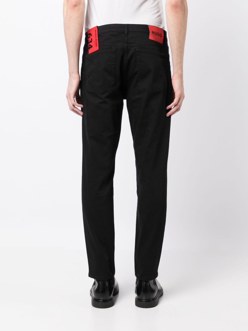 logo-patch stretch tapered jeans - 4