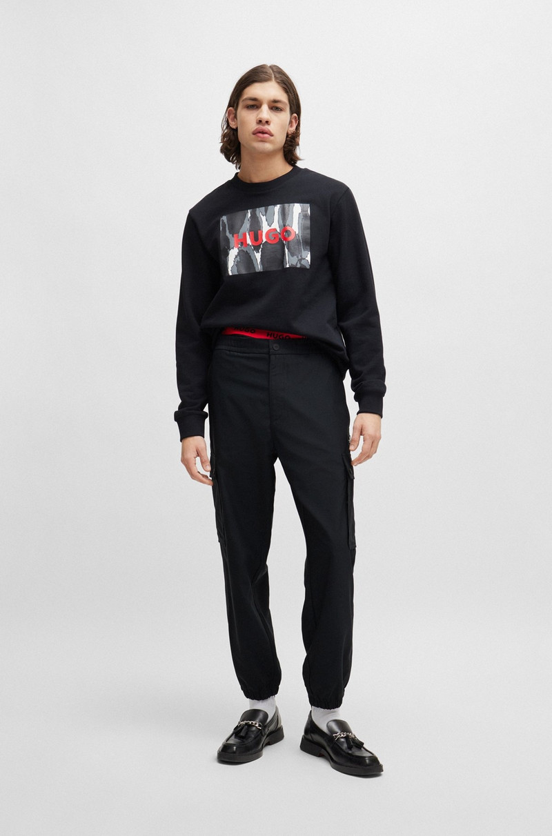 HUGO REGULAR-FIT TROUSERS IN WATER-REPELLENT MATERIAL outlook