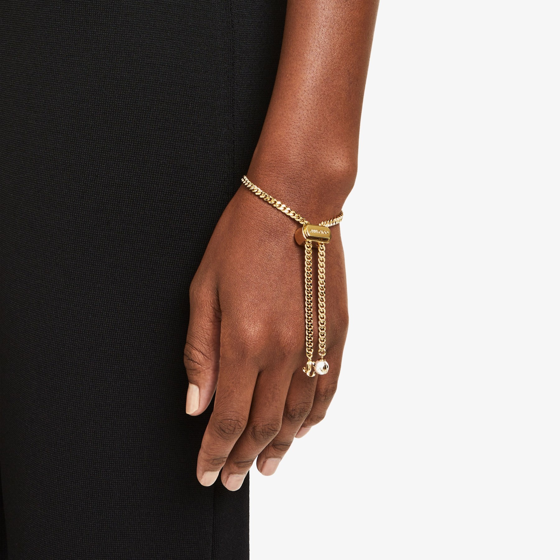 Bon Bon Bracelet
Gold-Finish Metal Bracelet with Pearl and JC Charm - 2