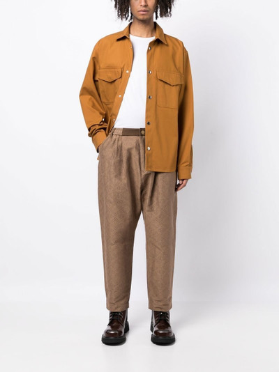 White Mountaineering geometric-print tapered trousers outlook