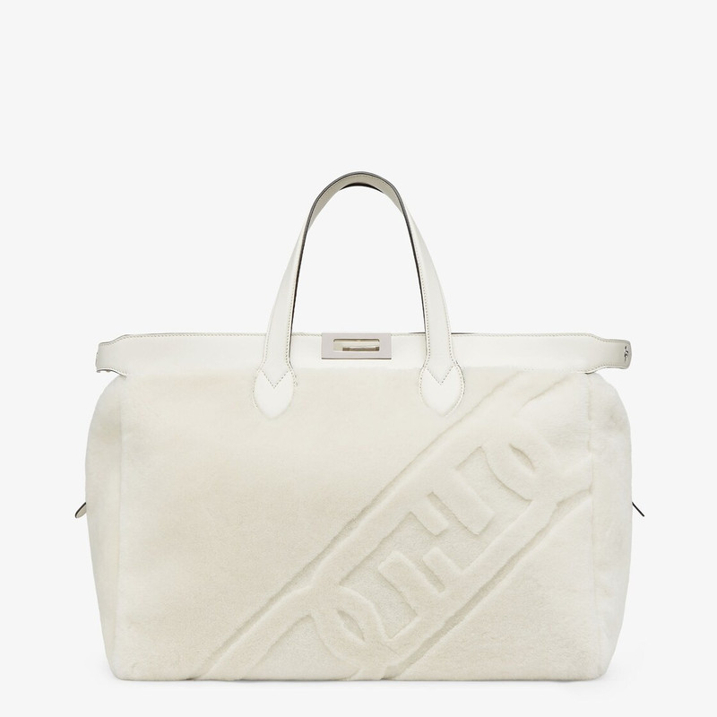 Peekaboo ISeeU Forty8 bag made of soft white sheepskin with an oversized shaved O’Lock motif. Roomy  2