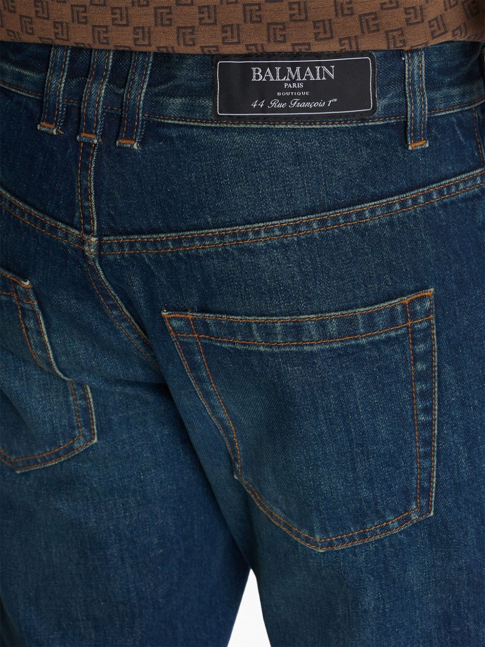 Vintage logo-patch straight-leg jeans - 7