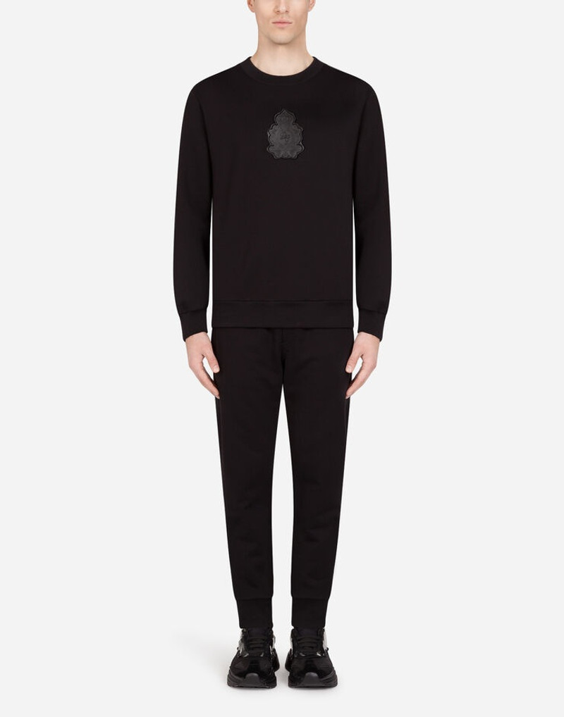 Jogging pants with rubberized logo patch 5