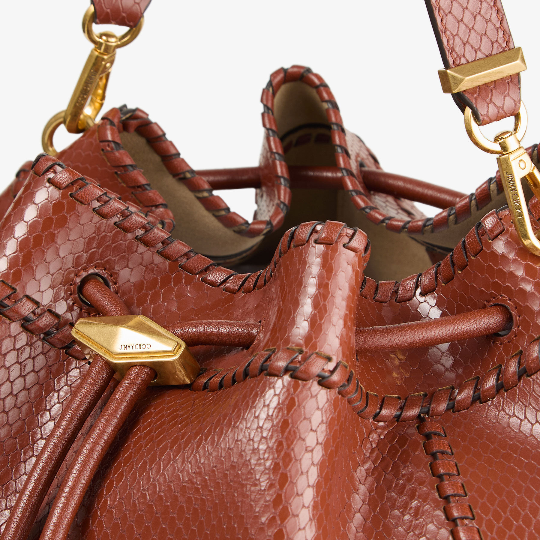 Cinch M
Cognac Elaphe Printed Leather Bucket Bag with Biker Leather Whipstitching - 4