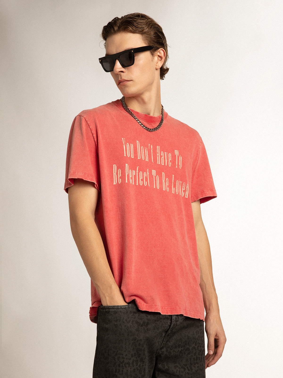 Pale pink men’s T-shirt with lettering in the center