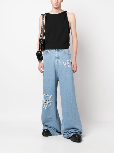 VETEMENTS logo-distressed baggy jeans outlook