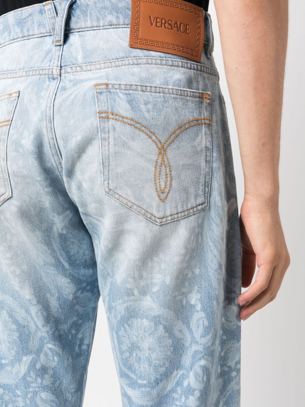 Allover logo-print jeans - 5