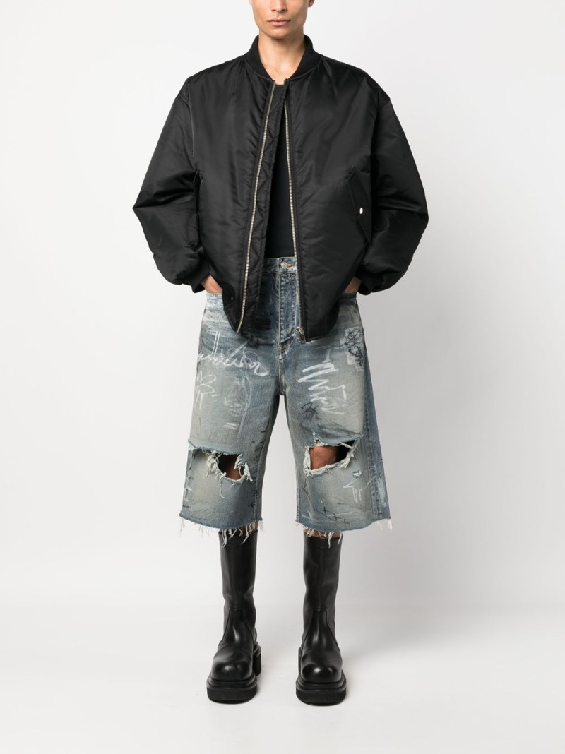 BALENCIAGA Baggy graffiti-print denim shorts outlook