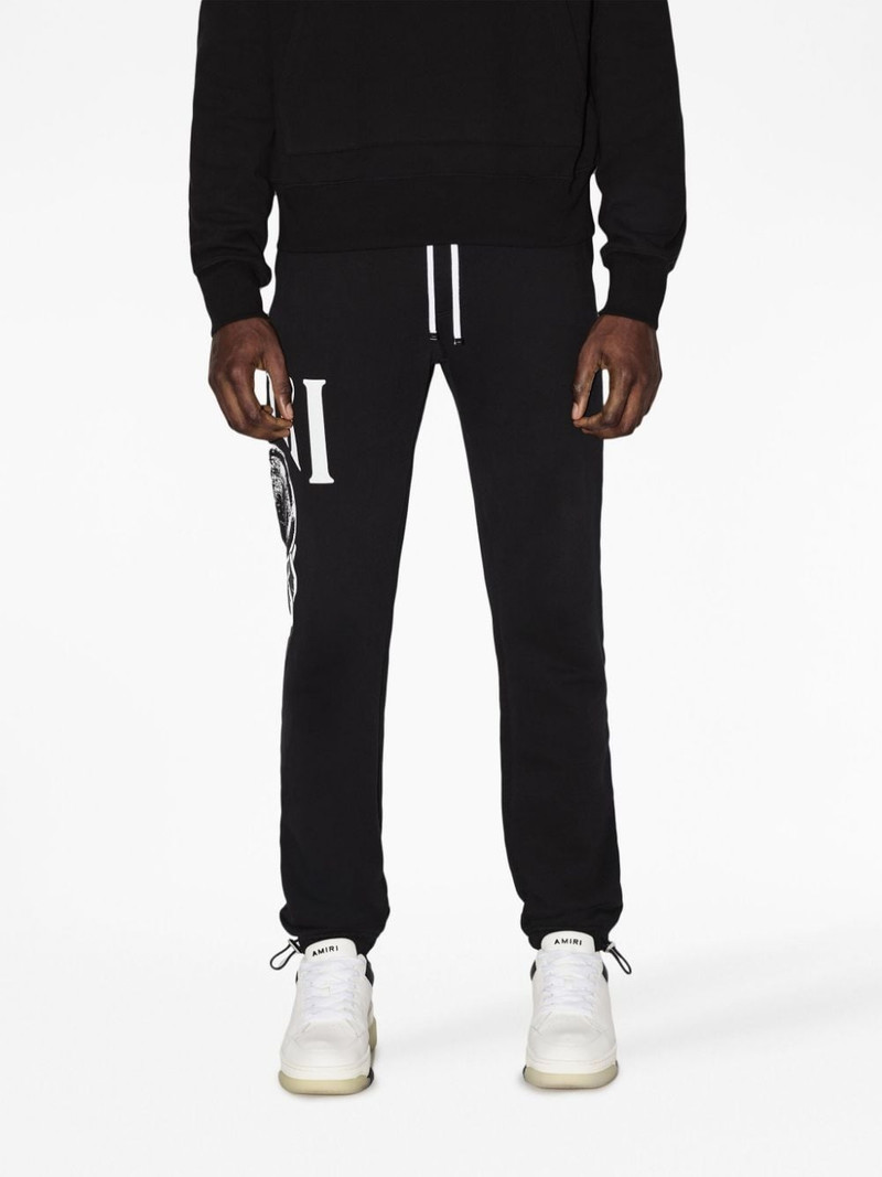 AMIRI graphic-print cotton track pants outlook