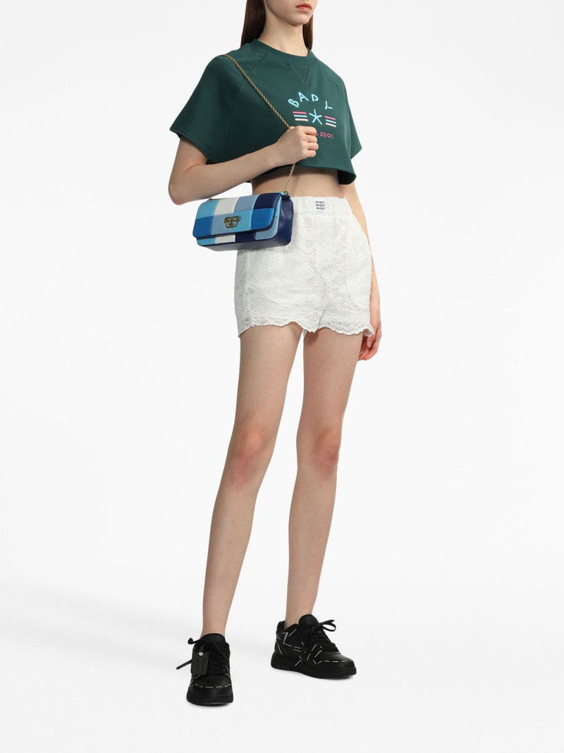 MSGM logo-patch scalloped lace shorts outlook