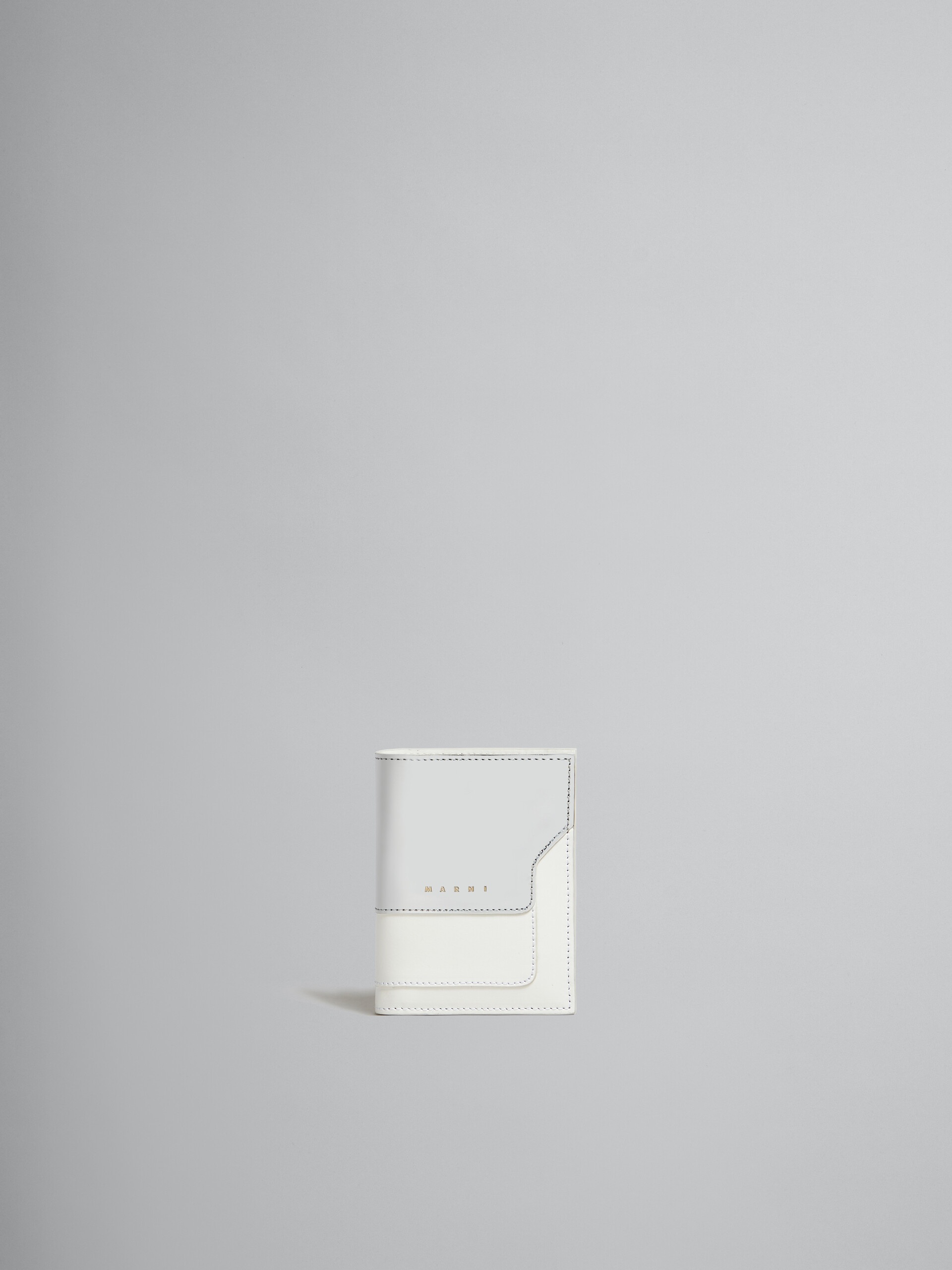 WHITE AND SILVER LEATHER BI-FOLD WALLET - 1