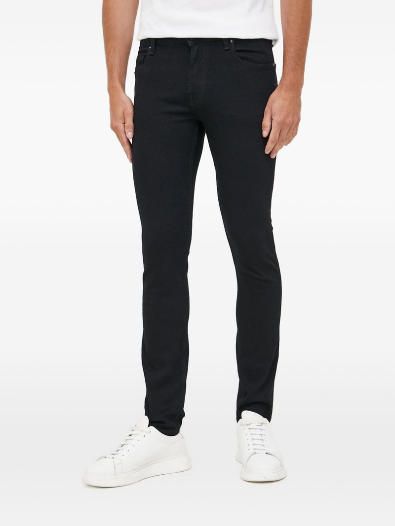 Chris logo-patch jeans 1