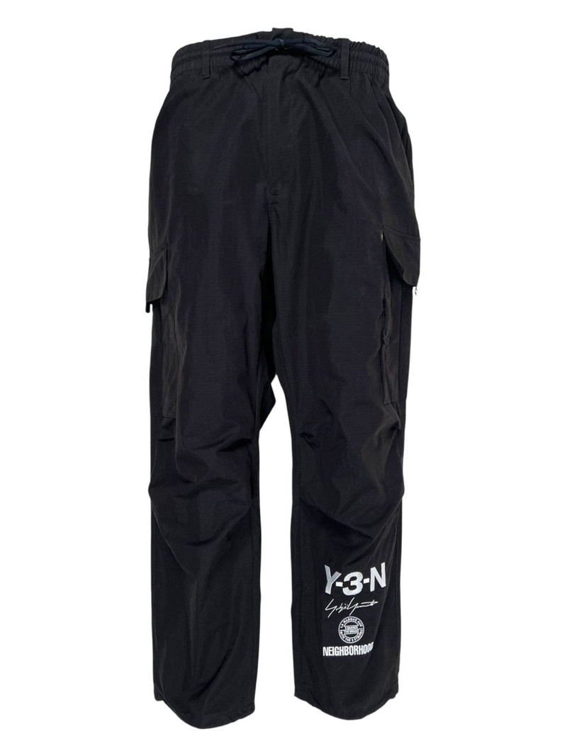 x Neighborhood logo-print cargo-pocket trousers 1