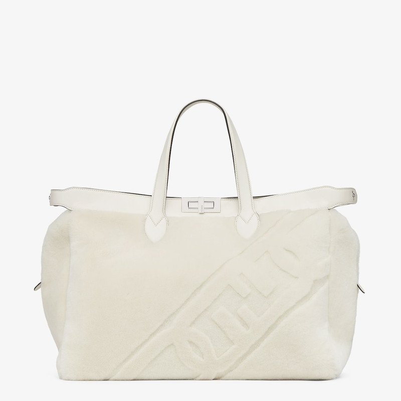 Peekaboo ISeeU Forty8 bag made of soft white sheepskin with an oversized shaved O’Lock motif. Roomy  1