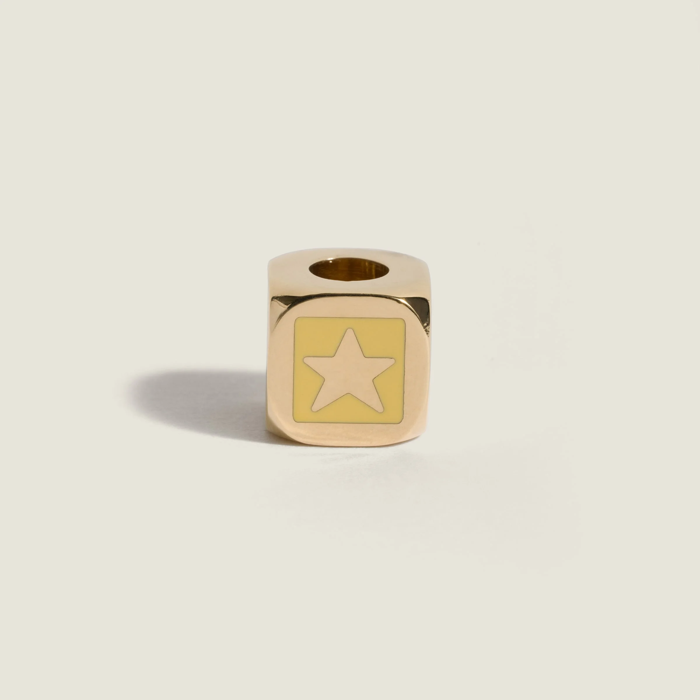 Enameled metal dice charm with star - 1