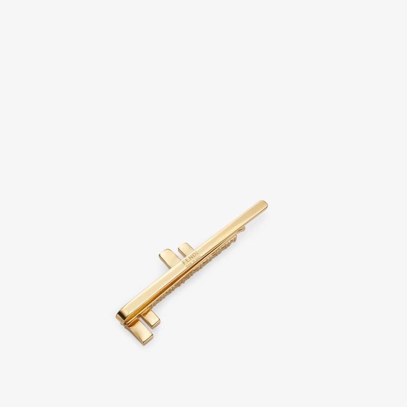 FENDI Hair clip with Fendi First logo. Made of gold-finish metal. Decorated with circular white crystals w outlook