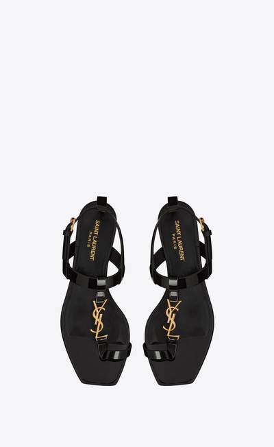 SAINT LAURENT cassandra flat sandals in patent leather with gold-tone monogram outlook