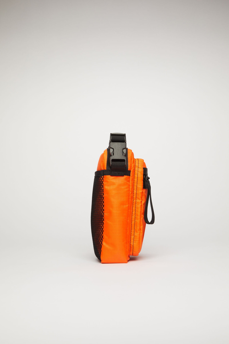 Acne Studios Logo plaque pocket bag dark orange outlook