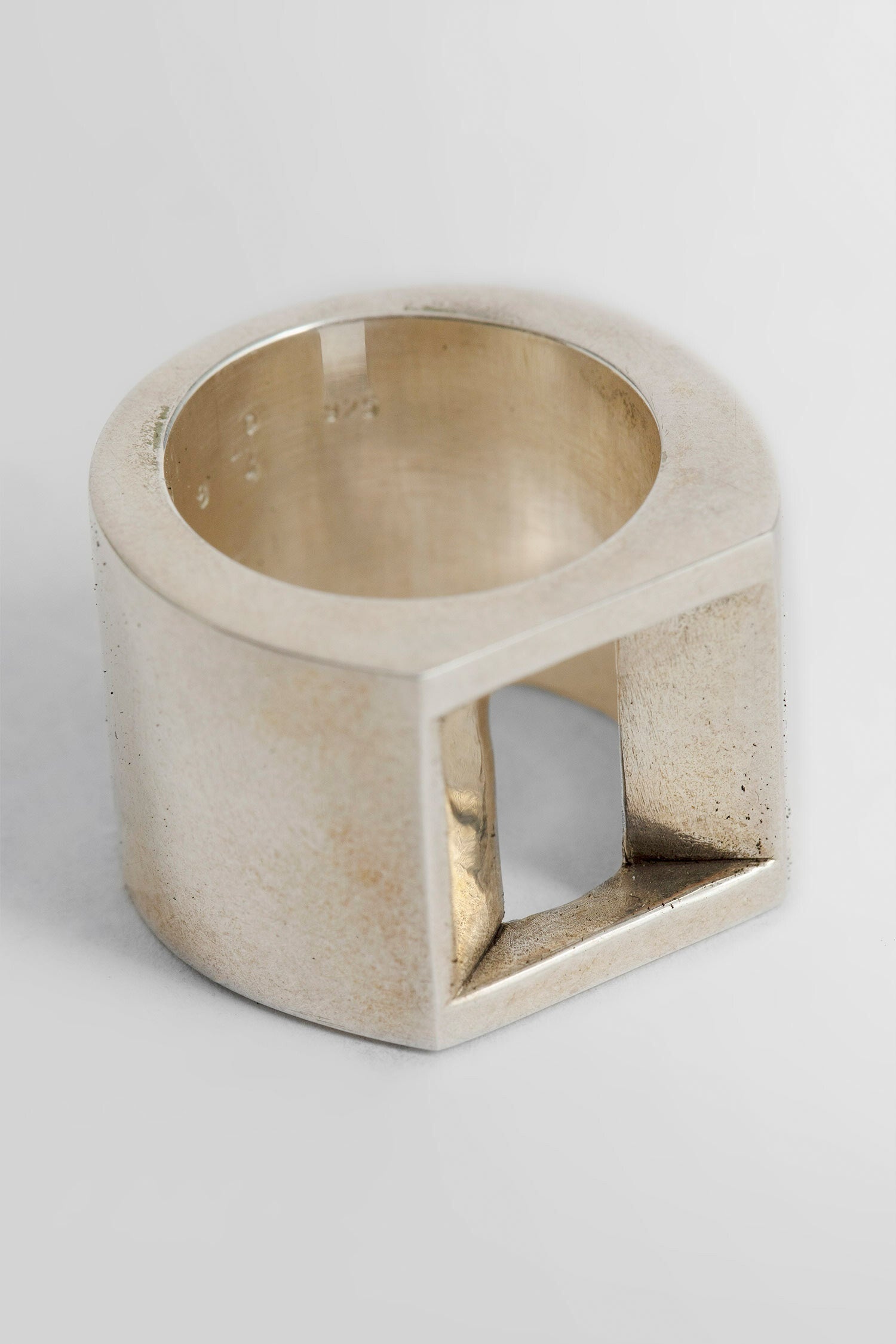 PARTS OF FOUR UNISEX SILVER RINGS - 4