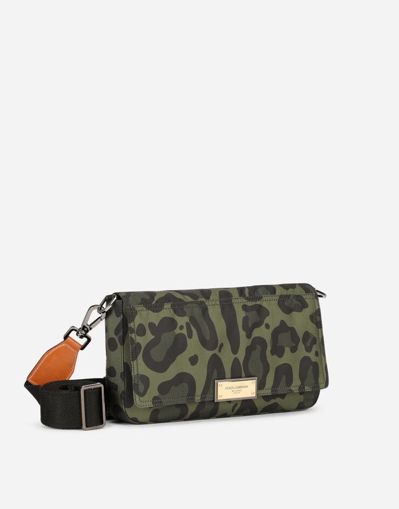 Nylon crossbody bag with leopard print against a green background and branded plate 3