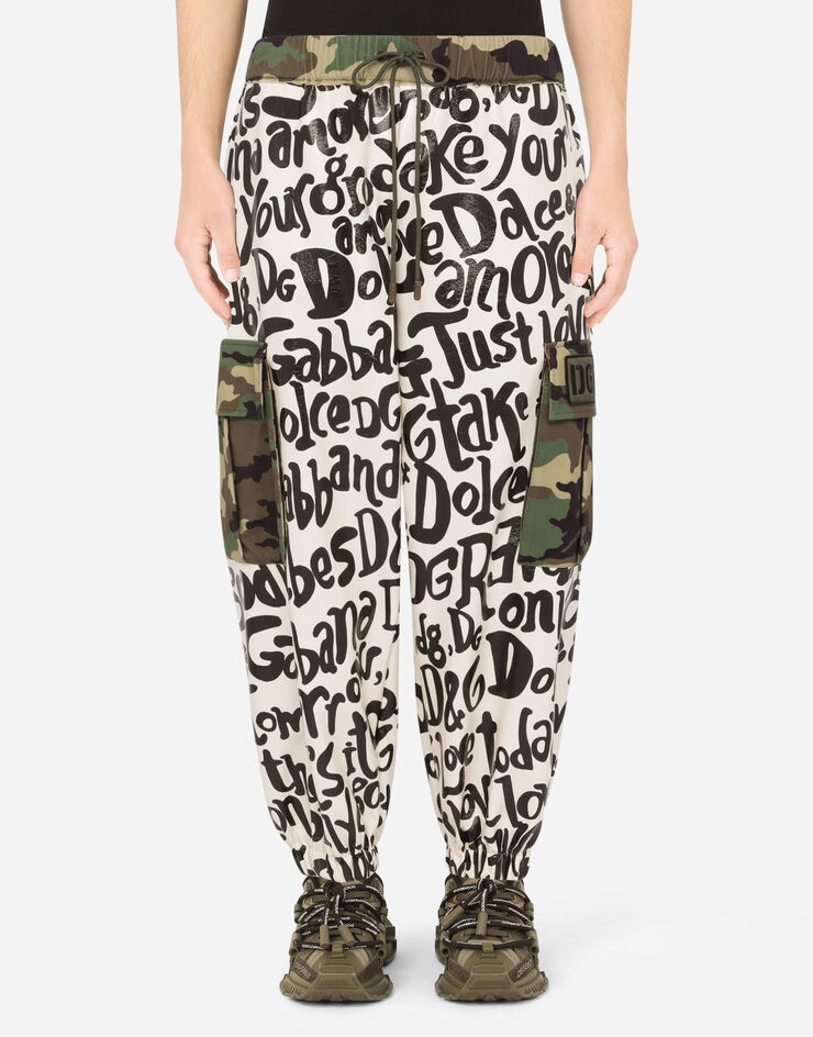 Printed jogging pants with camouflage details - 1