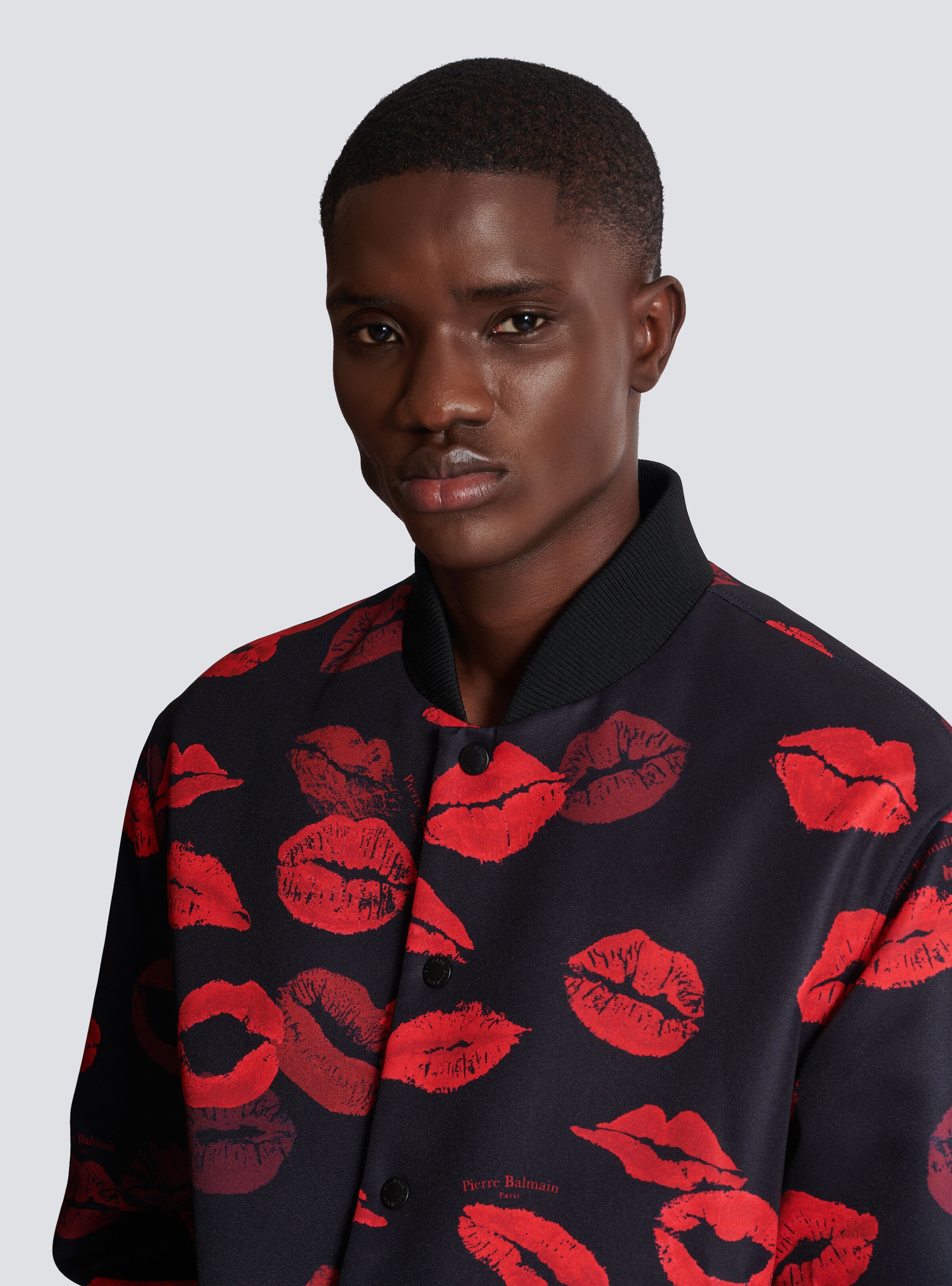 Reversible bomber jacket in plain and Kiss-print nylon - 7