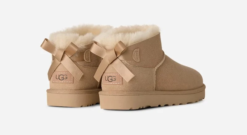® Women's Ultra Mini Bailey Bow Sheepskin Classic Boots in Sand - 1