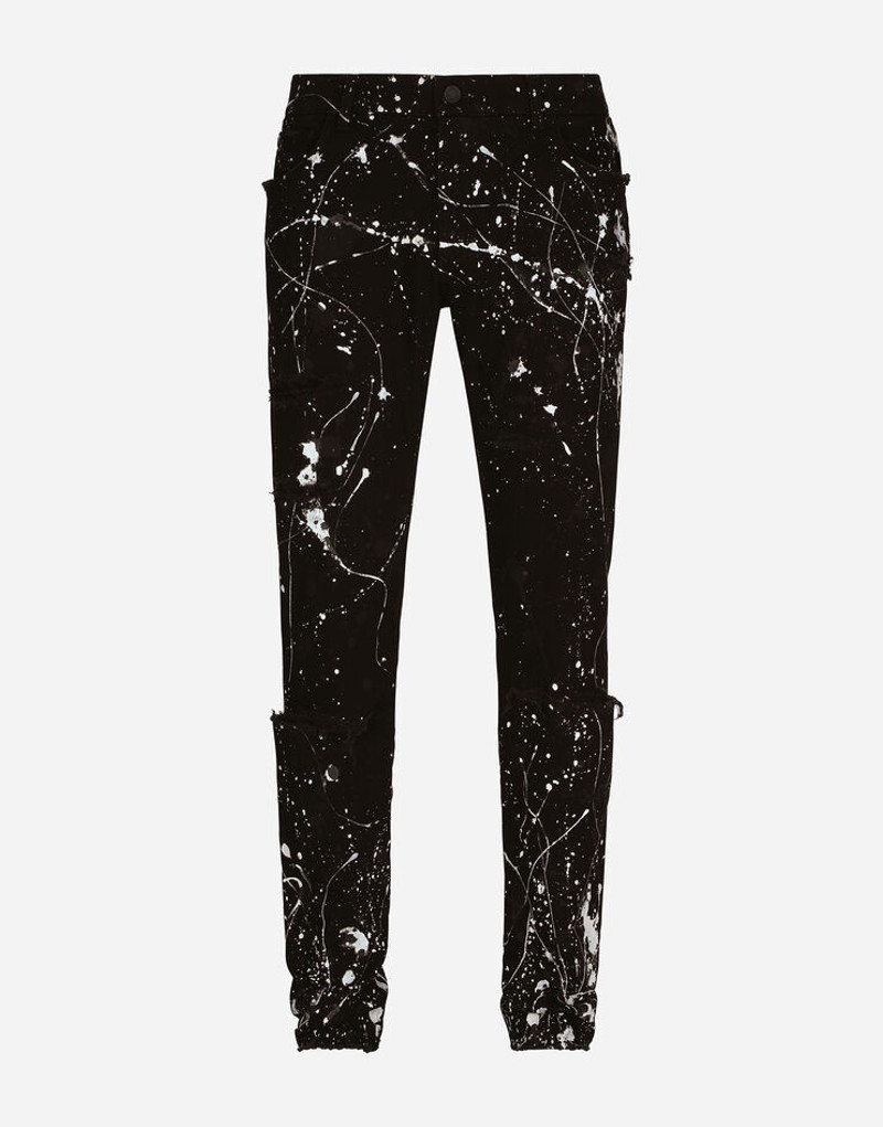 Skinny stretch jeans with rips and splash design 1