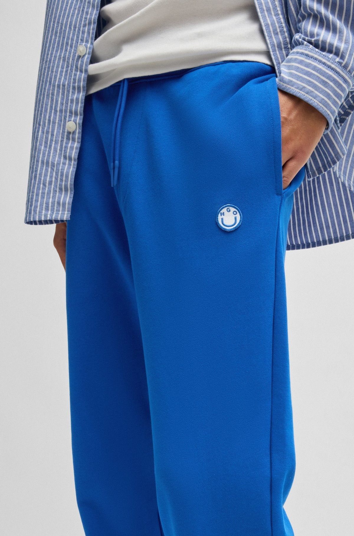 COTTON-TERRY TRACKSUIT BOTTOMS WITH HAPPY HUGO LOGO PATCH - 3