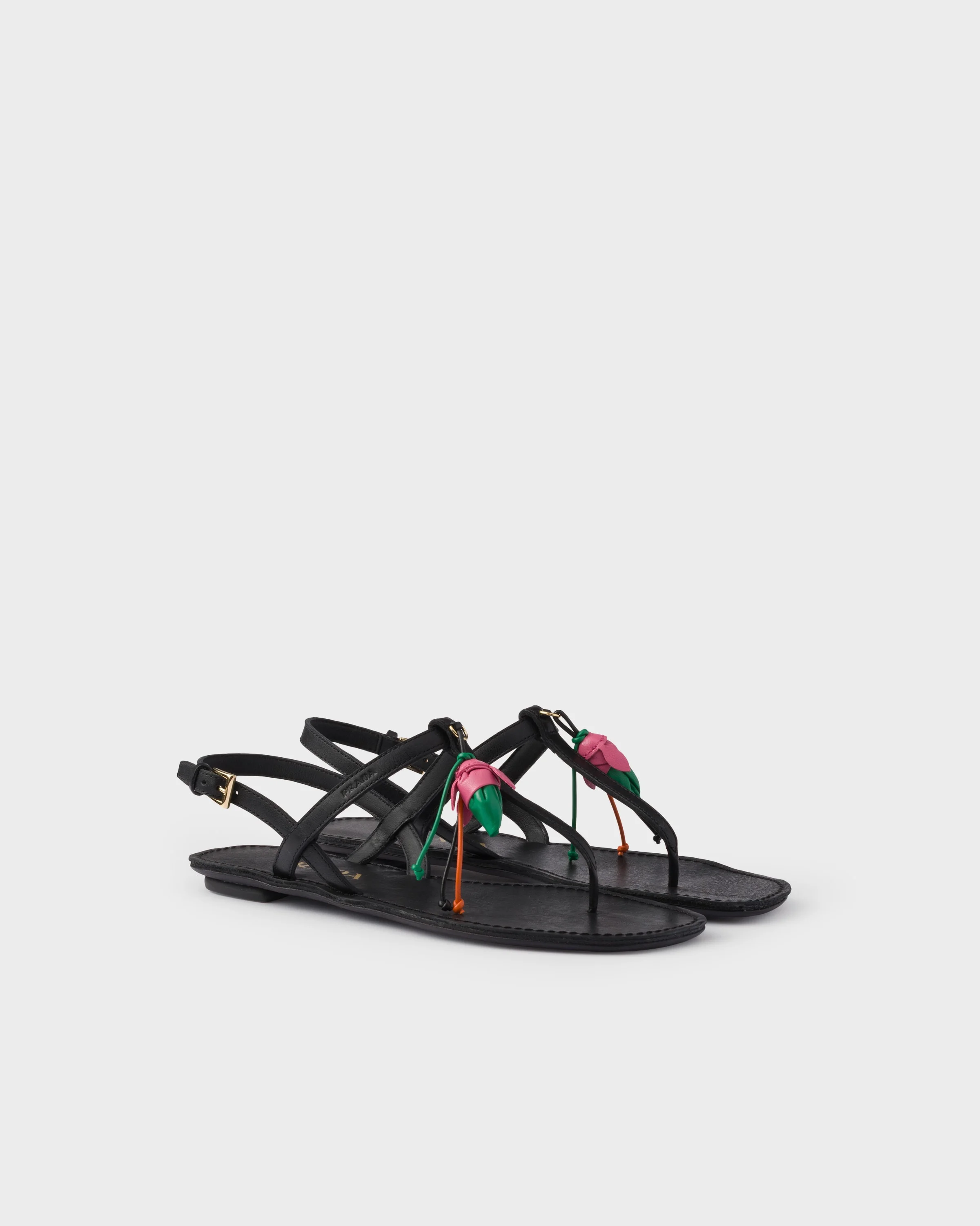 Antiqued leather thong sandals with floral ornament - 1
