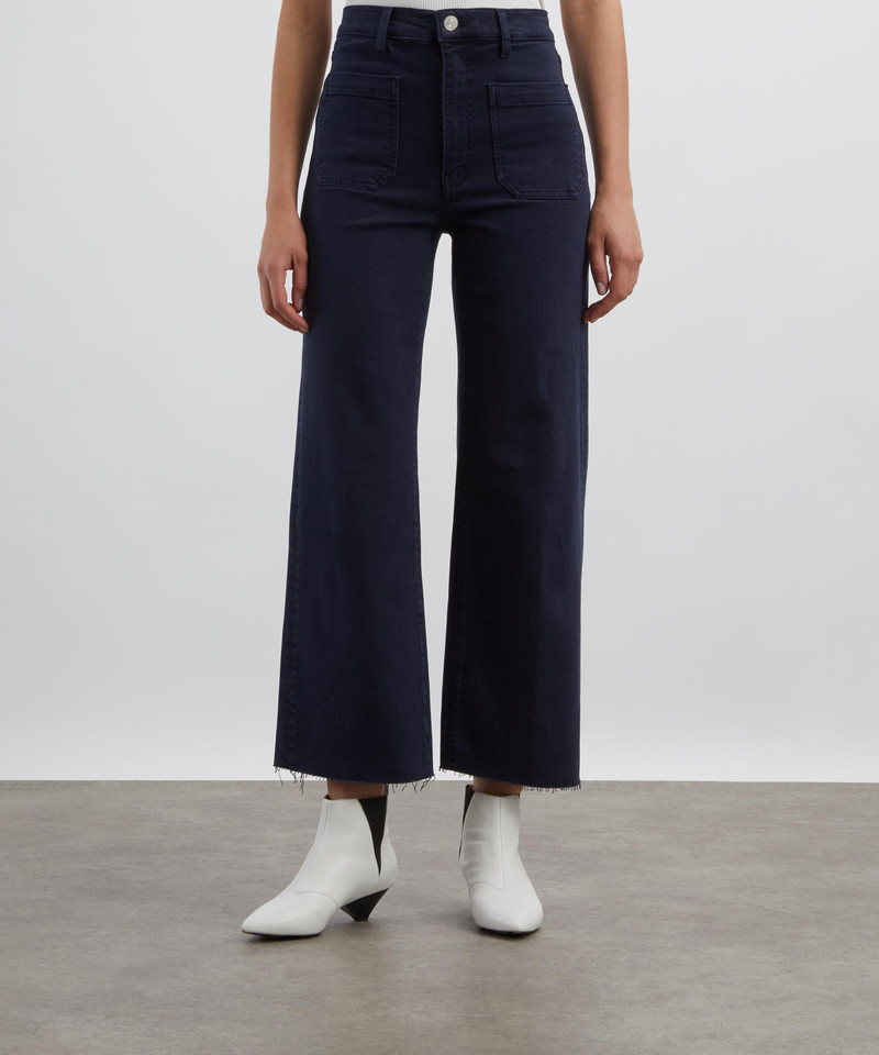FRAME The Anchor High-Rise Wide Jeans in Navy Raw Fray outlook