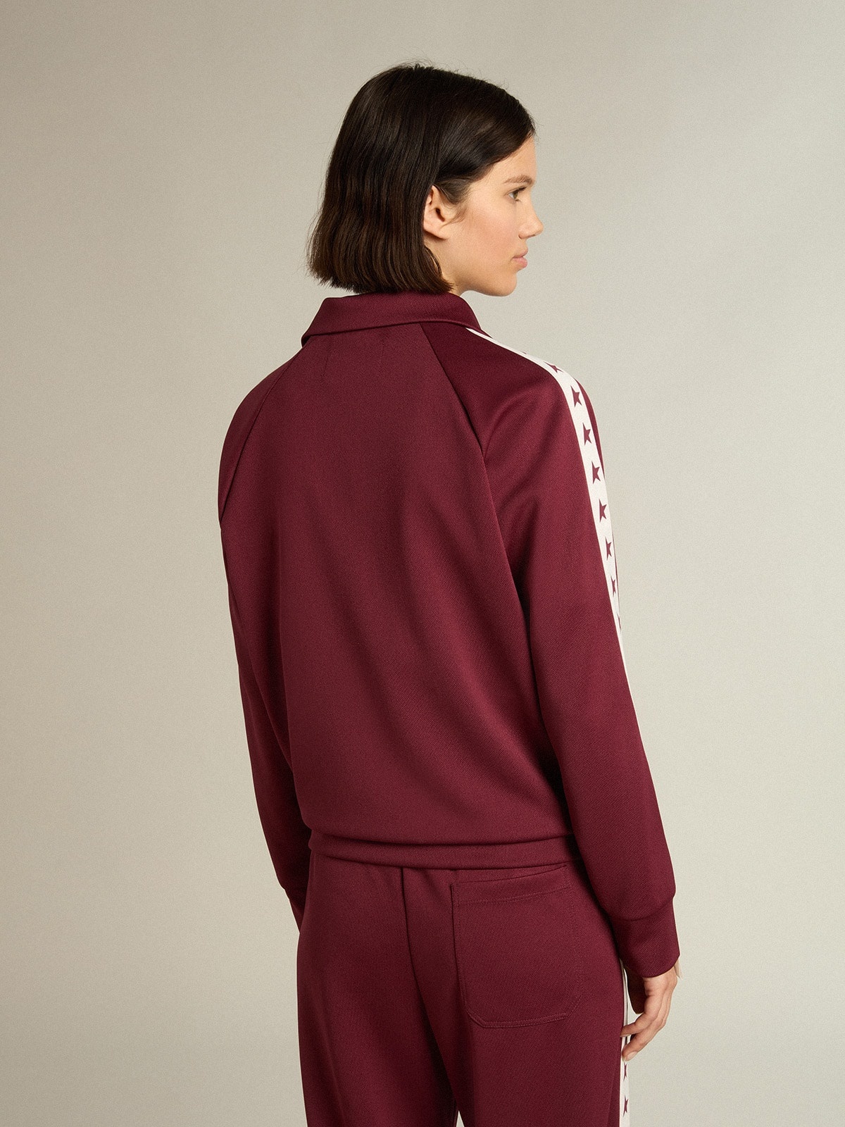 Women’s burgundy zipped sweatshirt with white strip and contrasting stars - 4
