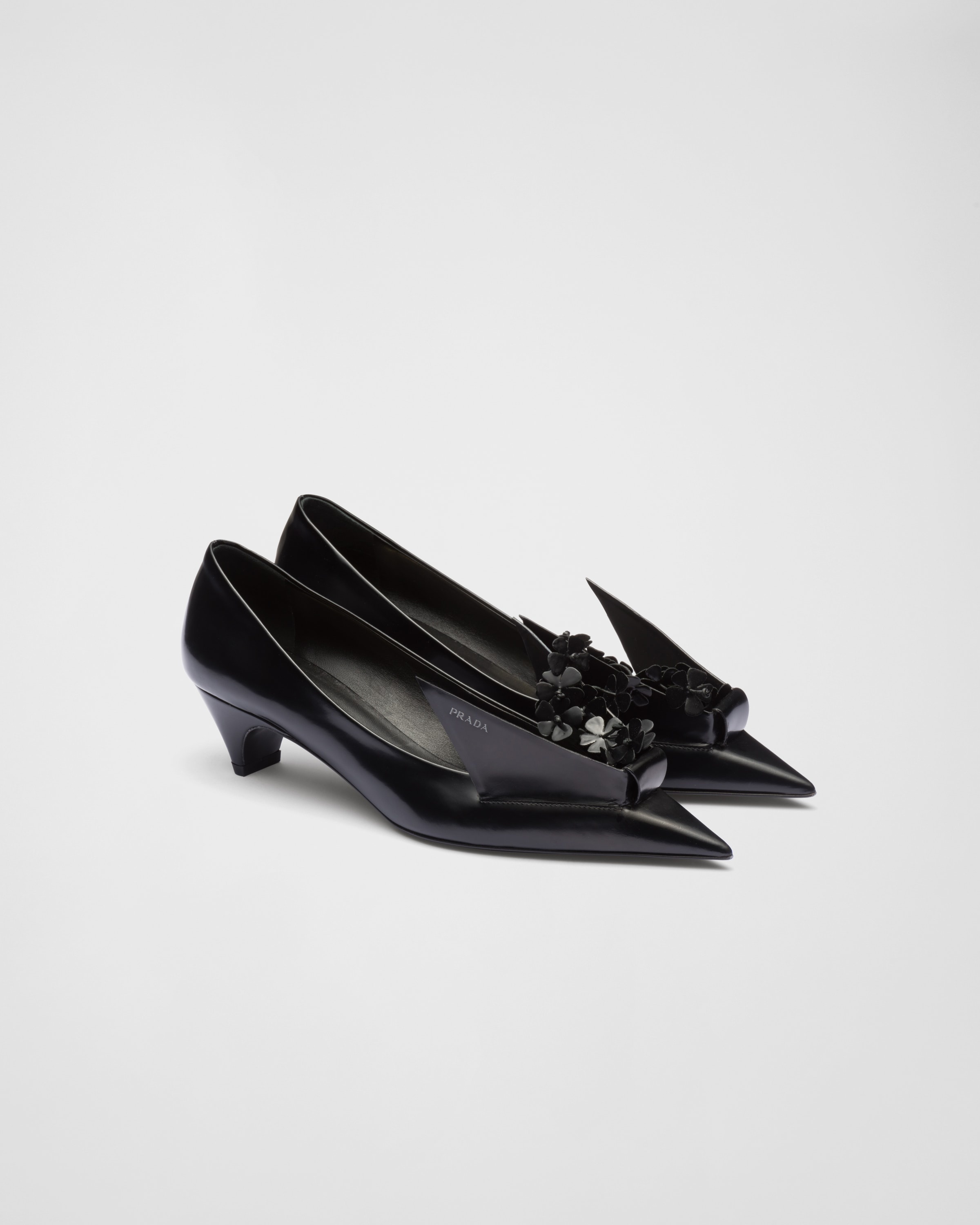Prada Brushed leather pumps with floral appliqués | REVERSIBLE