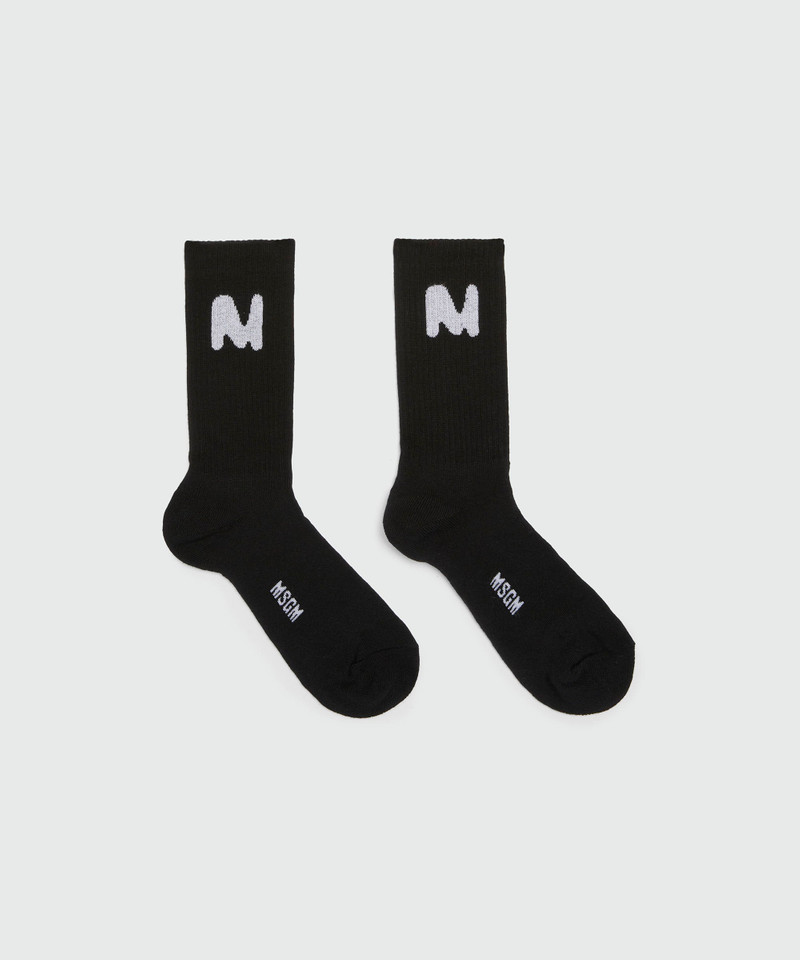 Black socks with "TheMwave" jacquard graphic 1