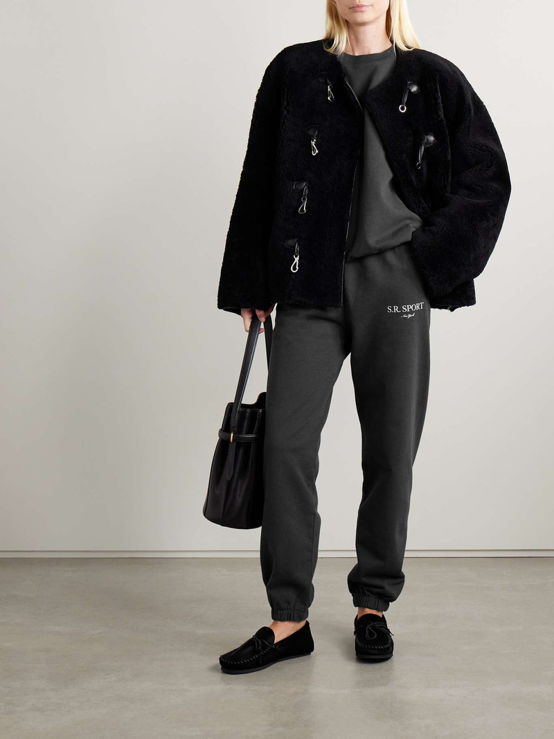 Sporty & Rich Printed cotton-jersey track pants Black outlook