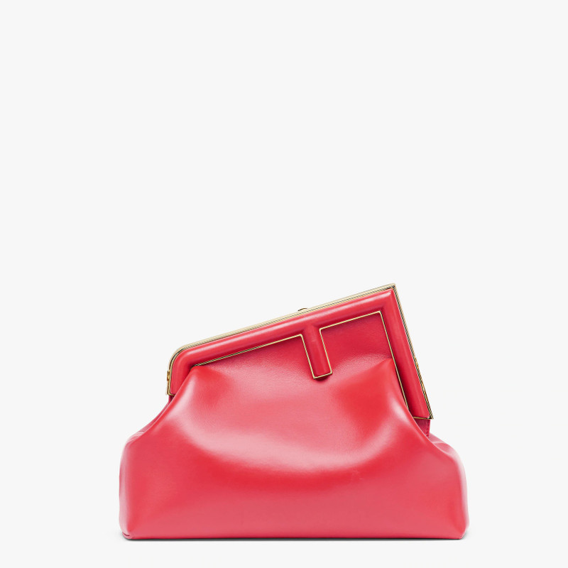 Medium Fendi First bag in fuchsia soft nappa leather with an oversized F metal clasp with tone on to 1