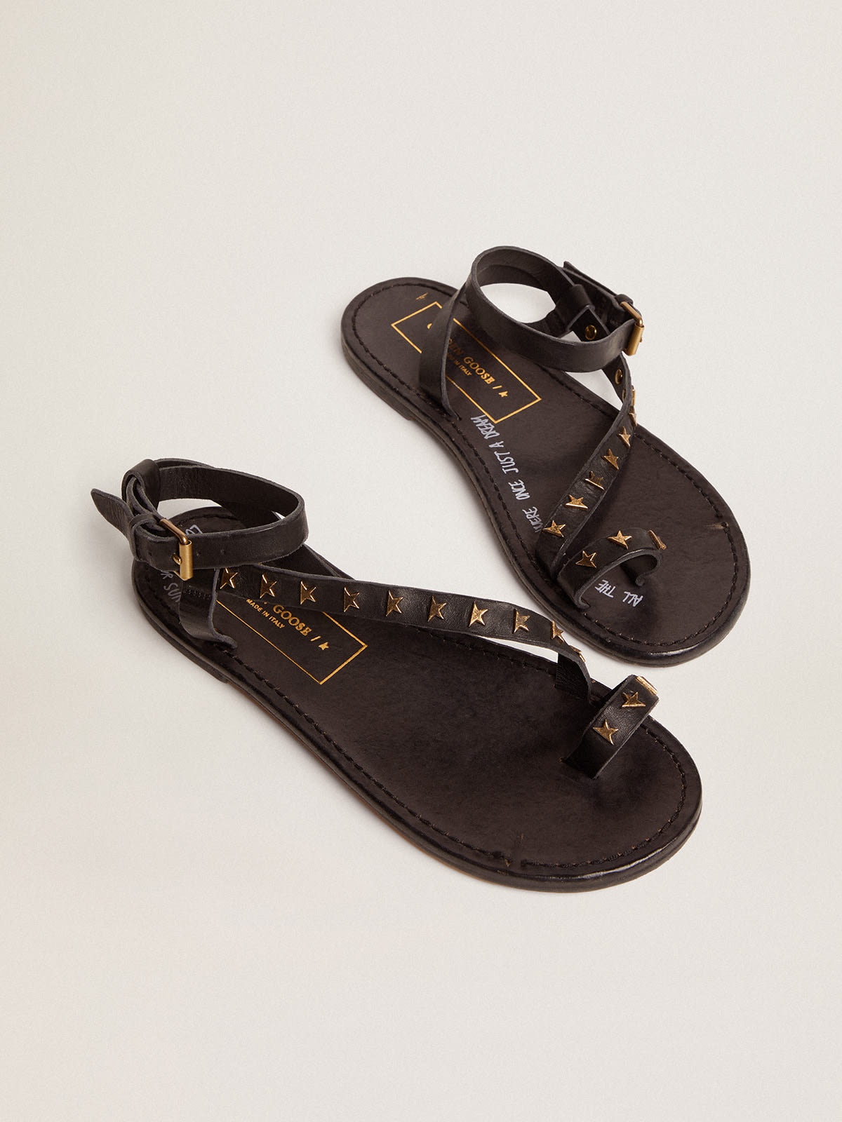 Women's flat sandals in black leather with gold stars - 2