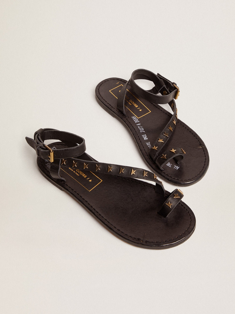 Women's flat sandals in black leather with gold stars 2