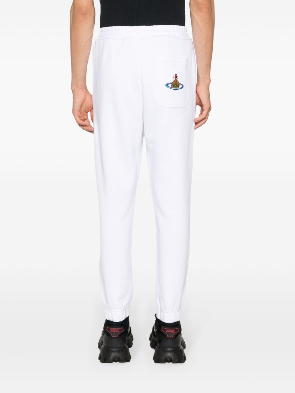 Orb-embroidered cotton track pants - 4
