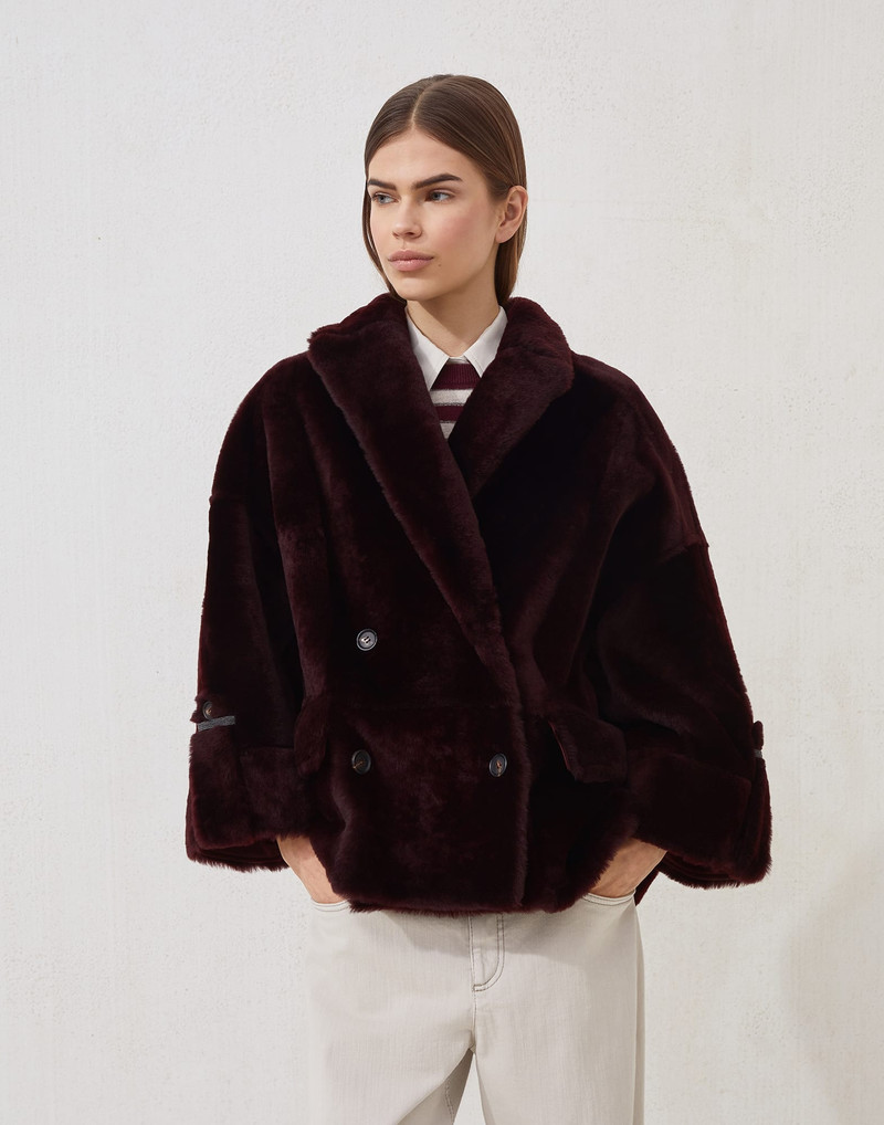 Reversible shearling outerwear jacket with shiny cuff details 1