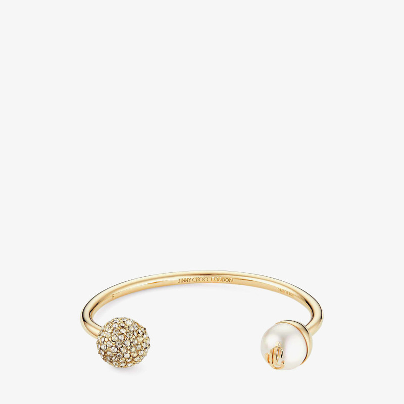 JC Crystal Cuff
Gold-Finish Metal Cuff Bracelet with Pearl and Swarovski Crystal Embellishment 1