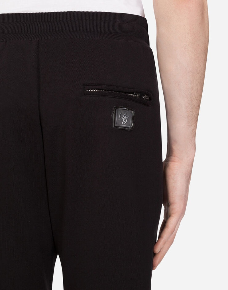 Jogging pants with rubberized logo patch 4