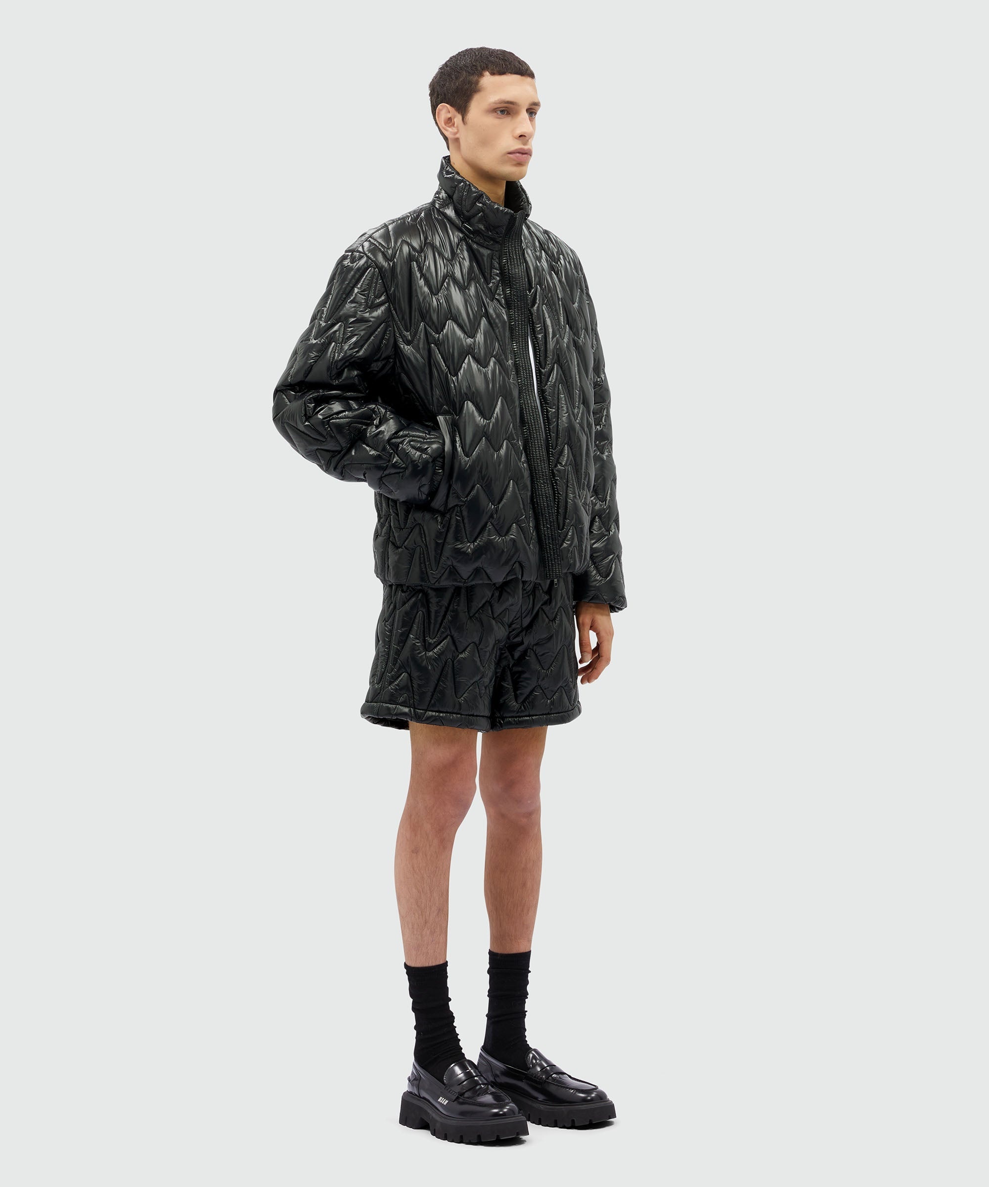 Black quilted jacket with "TheMwave" motif - 4