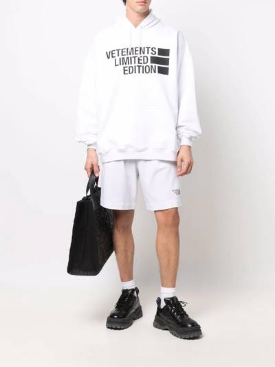 VETEMENTS logo-print track shorts outlook