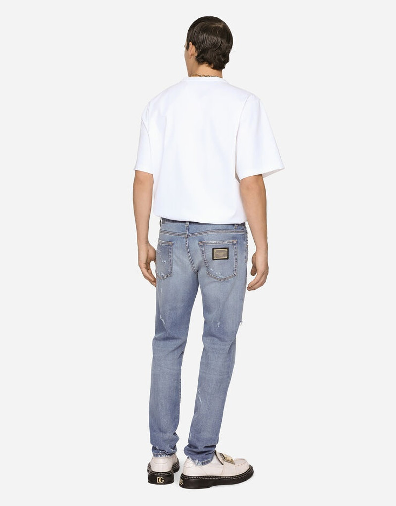 Light blue slim-fit stretch jeans with rips 2
