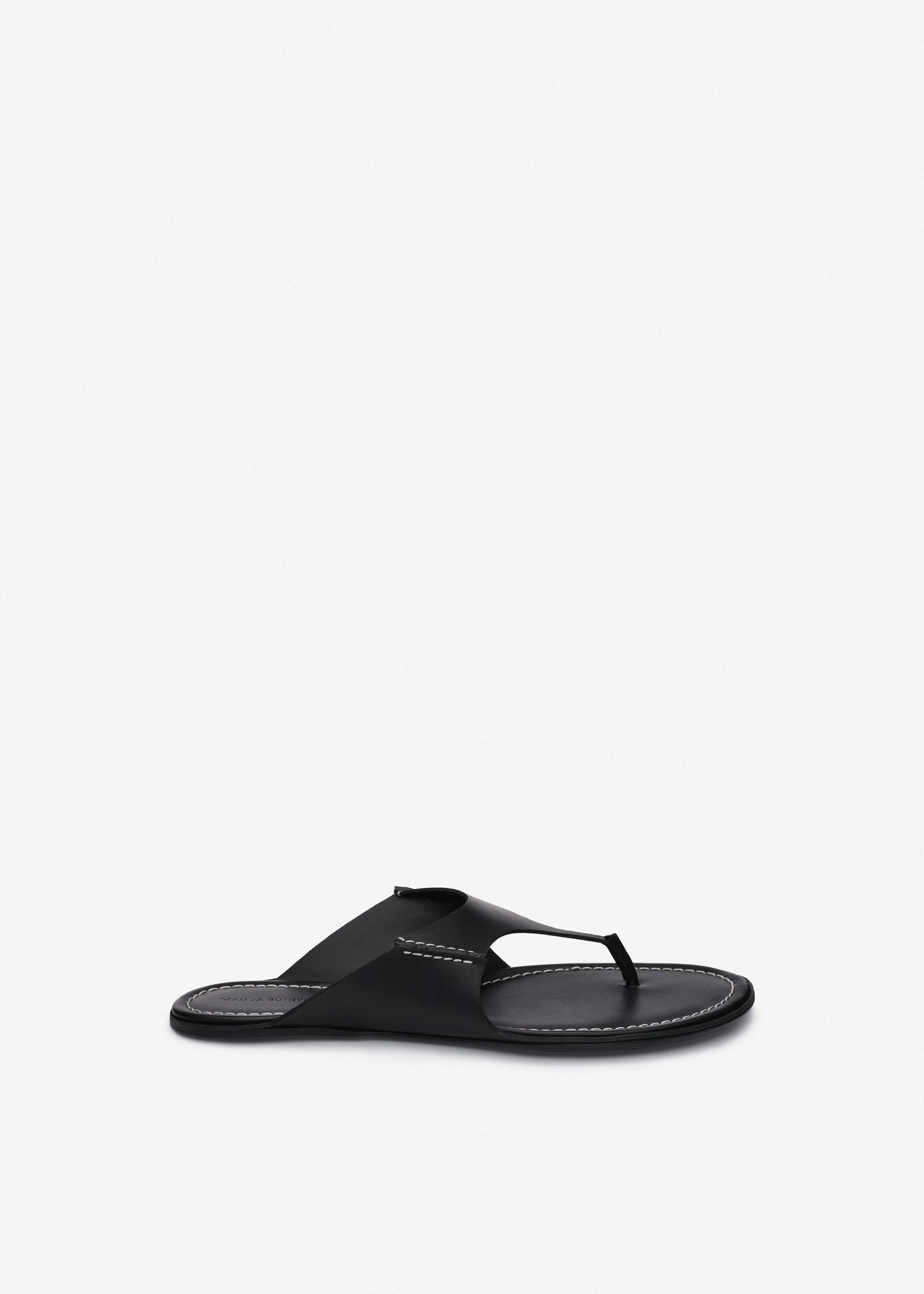 Leather thong flat sandals in black - 1
