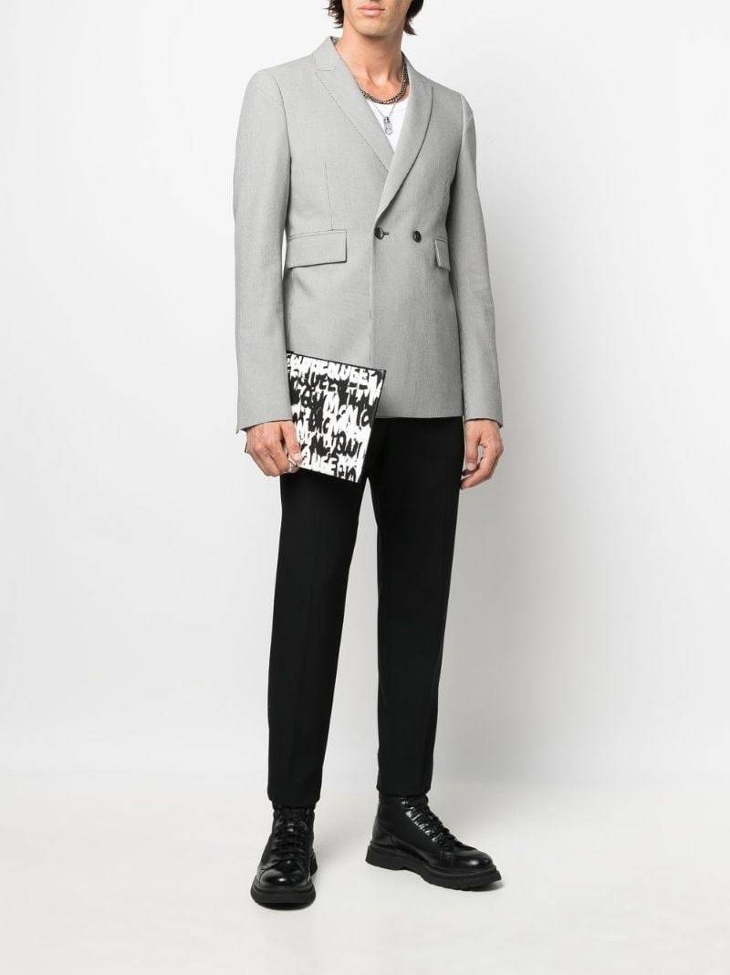 Alexander McQueen Graffiti all-over print clutch outlook
