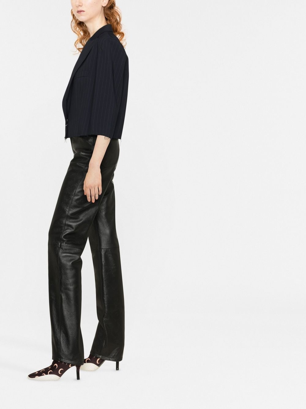 all-over embossed-logo leather trousers - 3