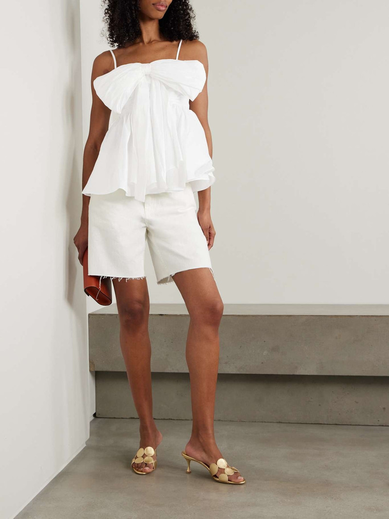 Aje. Scarlett bow-embellished crepe peplum top Ivory outlook